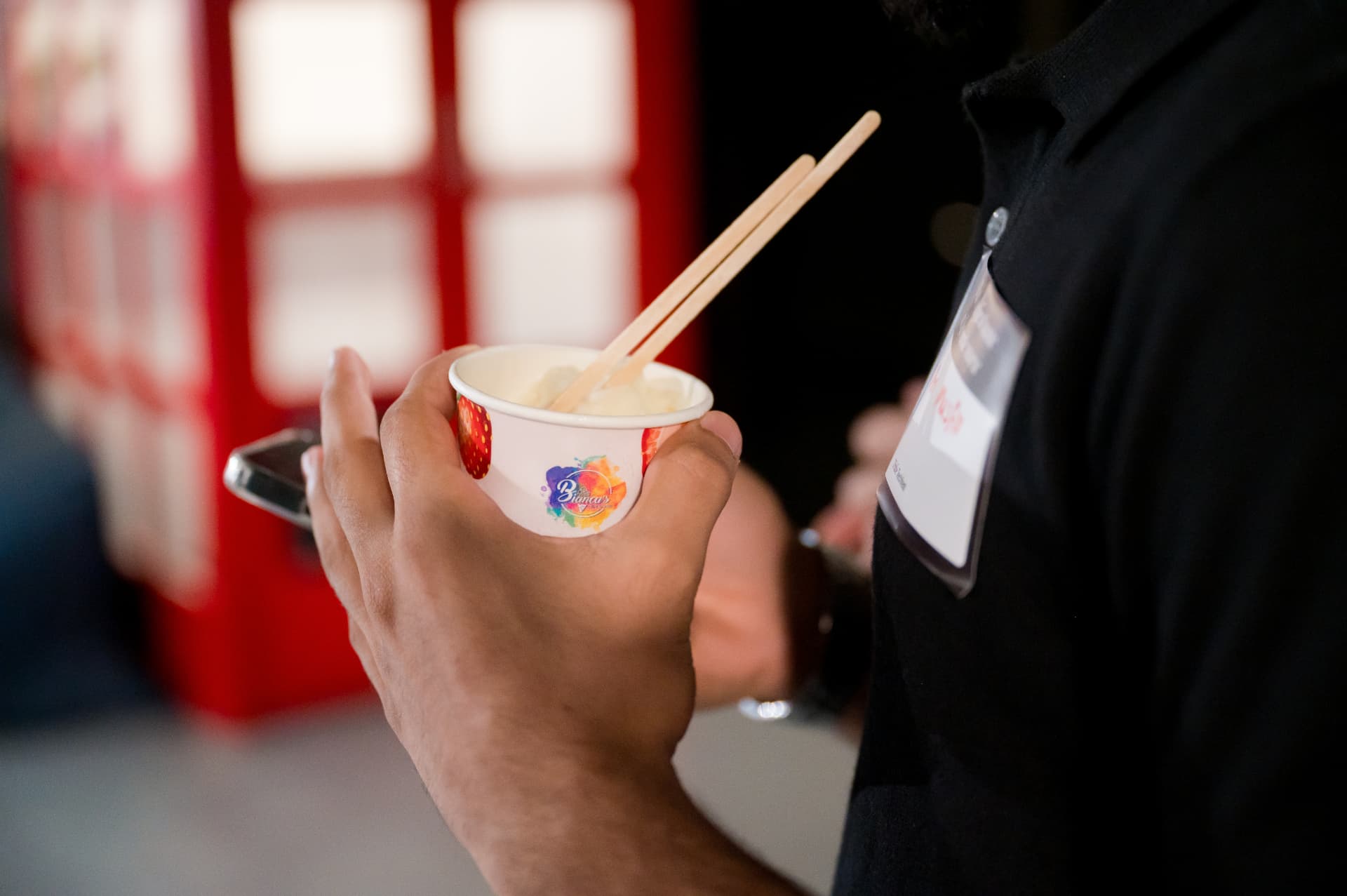 An attendee enjoying dessert at TechFest